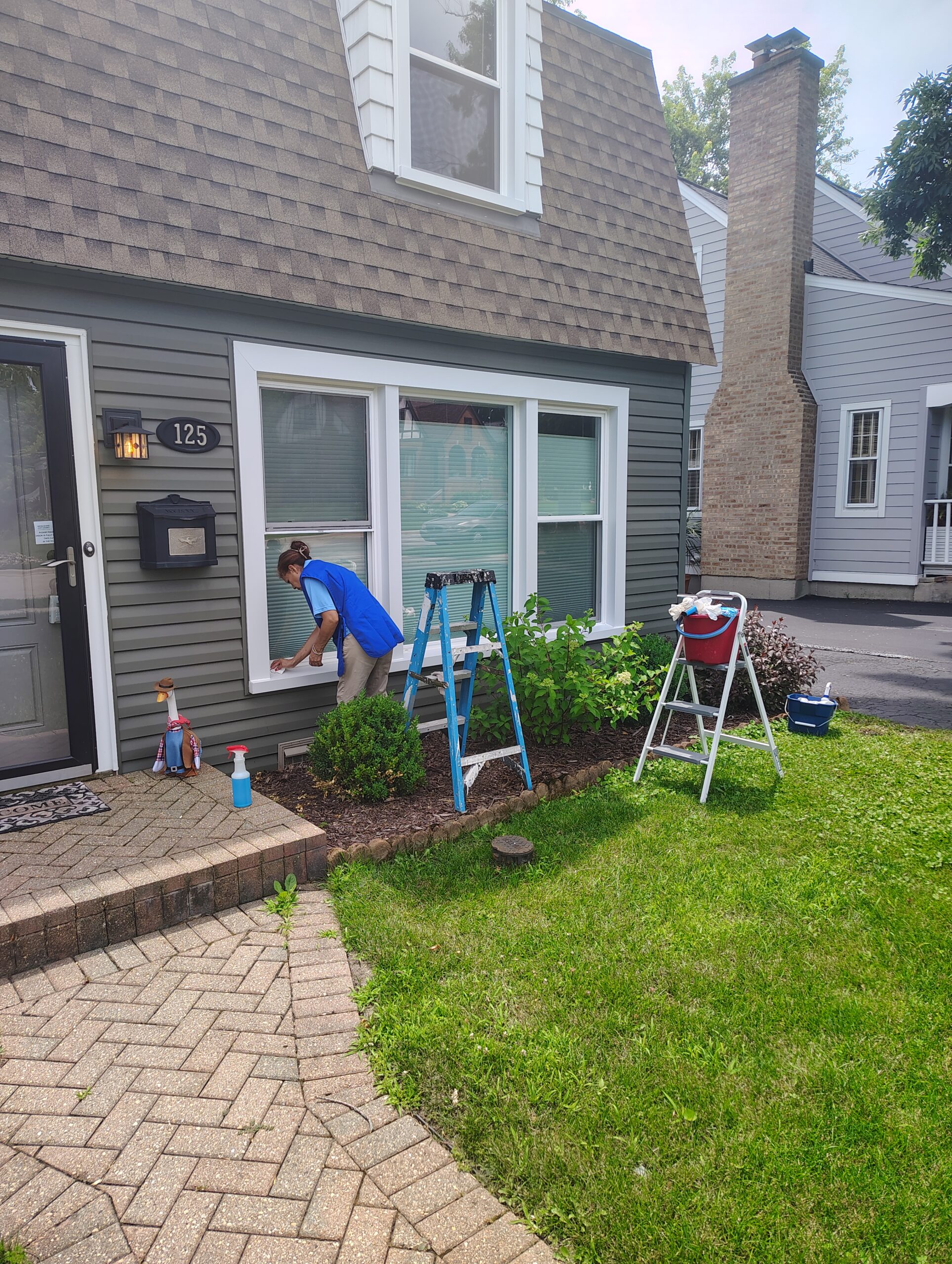 Super Clean Home Services team member cleaning windows before a home sale